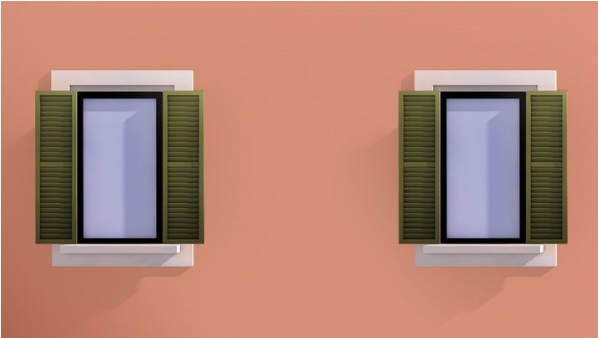 due finestre su muro arancione
